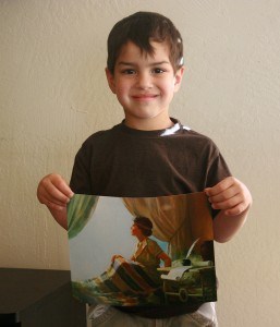 holding picture of the boy samuel