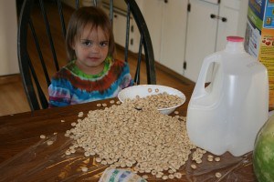 pouring her own cereal