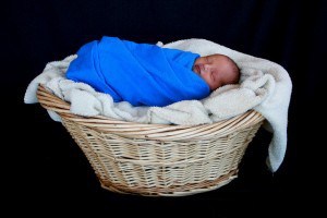 Jason swaddled in basket  full